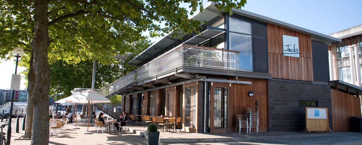Pavilion building with modern exterior and large balcony overlooking Bristol harbour.